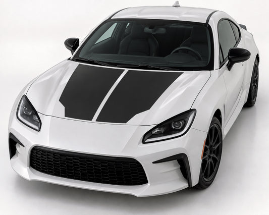 A white sports coupe with bold black racing stripes on the hood, shown from a three-quarter front angle on a clean light gray studio background.