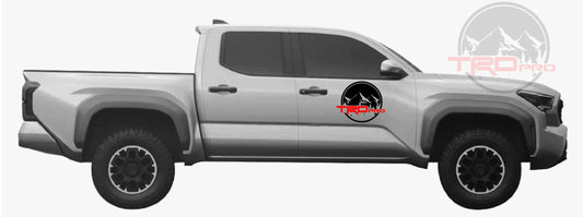 A gray Toyota Tacoma pickup truck with a set of black decals on the side, compatible with the TRD_Pro model.