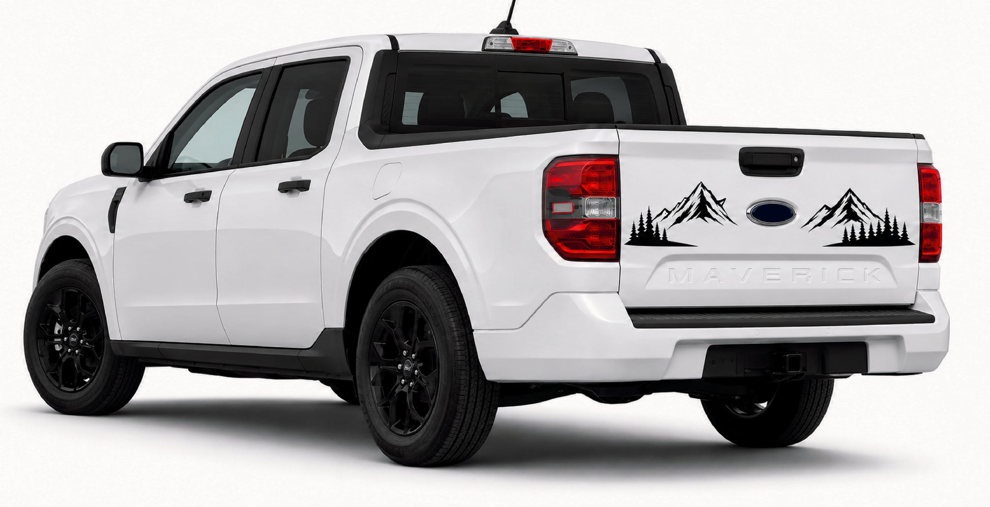 A white Ford Ranger pickup truck shown from a rear three-quarter angle, featuring black mountain and tree silhouettes decal graphics on the tailgate above the Ford logo.